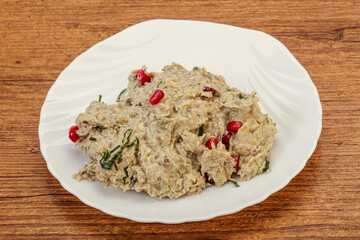 Vagan dietary cusine - mutabal with granet seeds