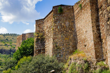 Fototapeta na wymiar It's Narikala Fortress, an ancient fortress overlooking Tbilisi, the capital of Georgia, and the Kura River.