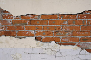 Cracked white grunge brick wall textured background stained old