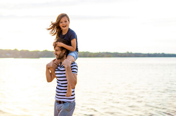 Father with a child spending the day at the beach

