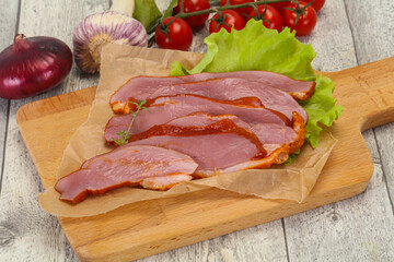 Sliced smoked duck breast served salad