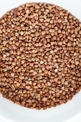 Macro overhead shot of buckwheat seeds as a background texture