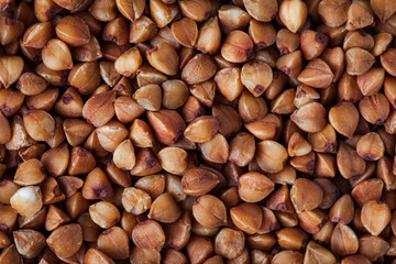 Macro overhead shot of buckwheat seeds as a background texture