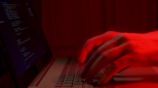 A Criminal Hacker Breaks Into A Secure Computer System. The Process of a Hacker Attack, a Close-up.