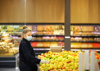 Supermarket shopping, face mask and gloves,Woman buying fruits at the market.