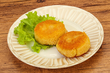Vegan cuisine - Potato cutlet in the plate