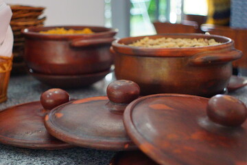 Typical   Javanese steam rice with its condiment in claypot