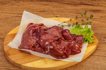 Raw chicken liver over board