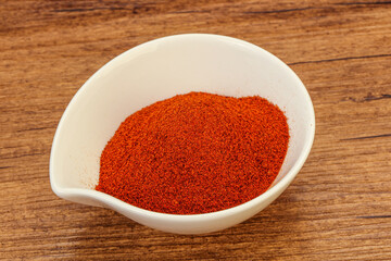 Dry paprika powder in the bowl