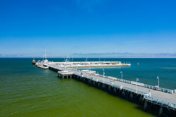 Sopot Aerial View. Sopot resort in Poland. Wooden pier (molo) with marina and yachts. Sopot is major tourist destination in Poland. - obrazy, fototapety, plakaty