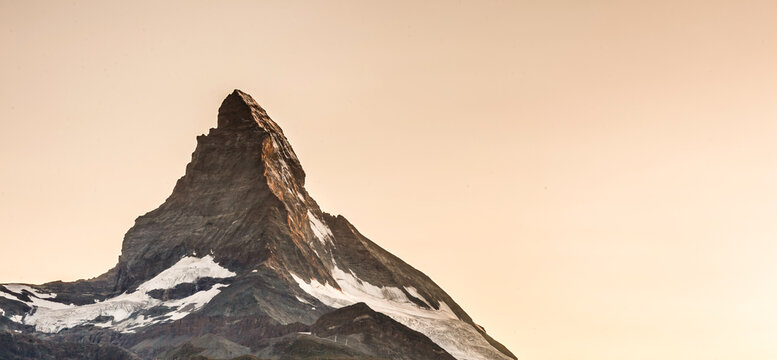 Zermatt, Switzerland. Matterhorn mountain near Grindjisee Lake with flowers in the foreground. Canton of Valais.