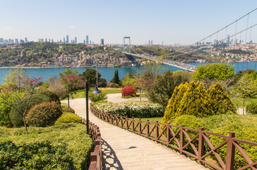 Istanbul, Turkey - completed in 1988 and one of the main landmarks in Istanbul, the Fatih Sultan Mehmet Bridge connects Europe and Asia. Here in particular the bridge seen from Fatih Korusu park - obrazy, fototapety, plakaty