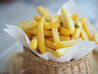 French fries potato snack golden yellow color Delicious crisp in wicker basket