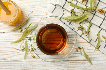 Composition with linden tea on wooden background, top view. Natural tea