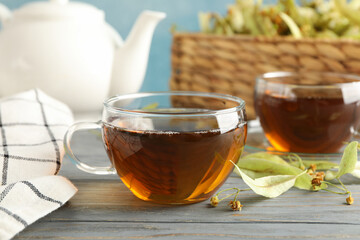 Composition with linden tea on wooden background, close up. Natural tea