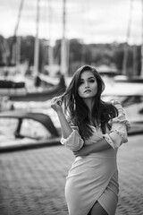 Beautiful girl wearing dress near the sea