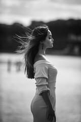 Beautiful girl wearing dress near the sea