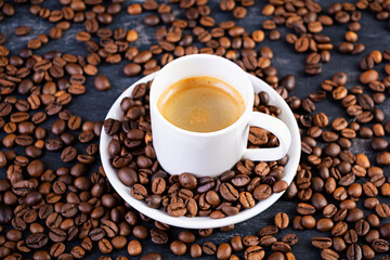 Cup of coffee espresso. Hot drink coffee on dark background
