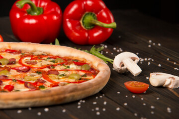 Half of pizza with bell pepper, green olives, sausages, mozzarella cheese, pepperoni, salami, chili...