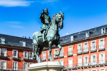 Fototapeta na wymiar It's Bronze statue of King Philip III on the Plaza Mayor, Madrid, Spain. It's the Spanish Property of Cultural Interest