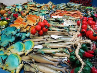 Sicilian craftmanship, ceramic objects in Noto, light blue fishes and yellow starfish,  Sicily