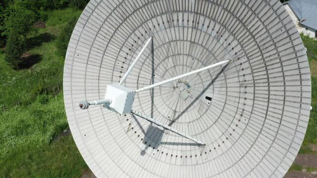 Quadrocopter shooting. Closeup of a radar disc.
Astronomy Observatory radio telescope. A large satellite dish against a blue sky. 