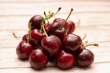 Fresh cherries on a wooden background