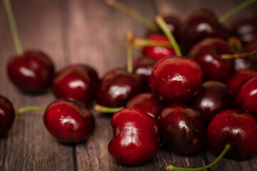 Fresh cherries on a wooden background