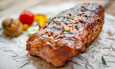 grilled meat ribs with vegetables on wooden table © pavel siamionov