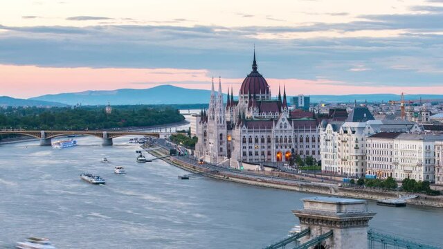 Time lapse with amazing view of Budapest with Parliament building, Chain bridge and Danube river at sunset.