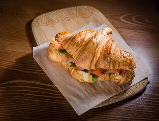  Freshly baked French croissants with red fish at a bakery