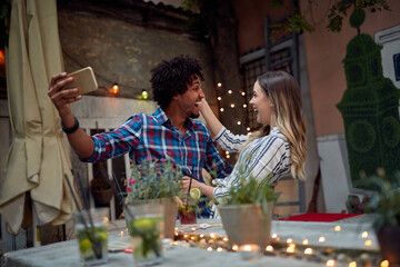Young couple in laugh taking a sefie