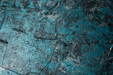 Blue concrete or textured putty with stains on the wall, background with copy space