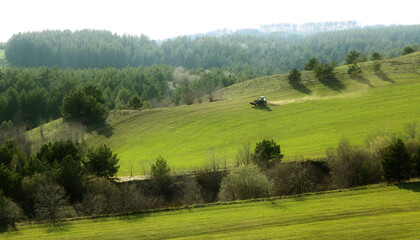 landscape with green hills and blue sky.