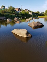 Naklejka premium Village on the banks of the river