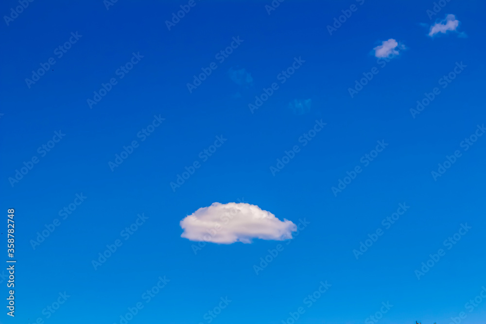 Wall mural a cloud on the clear sky