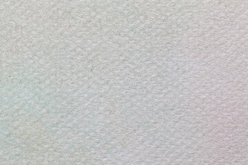 Texture of old gray paper backdrop, closeup. Structure of a matte porous cardboard, ivory wallpaper