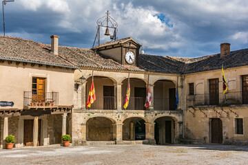 Town hall of the medieval town of Pedraza and its castle in the province of Segovia (Spain)