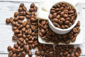Coffee beans and sugar cubes for cooking breakfast. Top view. Flatlay