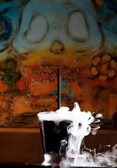 smoked drink with skull on background