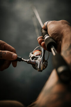 Close up of man holding fishing rod