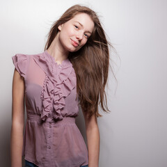 Young beautiful stylish girl posing in studio.