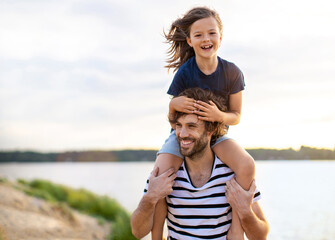 Father with a child spending the day at the beach
