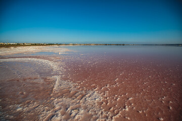 Beautiful wide vibrant summer view of las Salinas de Torrevieja, The Pink Lake Of Torrevieja, pink salt lagoon in Torrevieja, Costa Blanca, province of Alicante, Spain