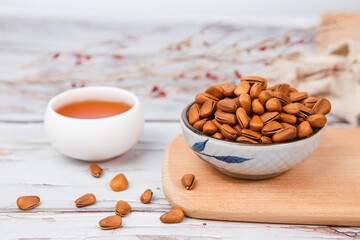 Pine nuts on wood background