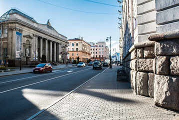 gray building with columns and statues