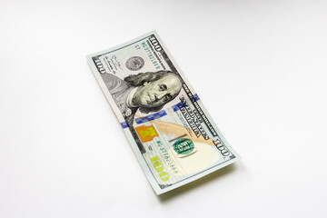 One hundred dollar bill on white background
