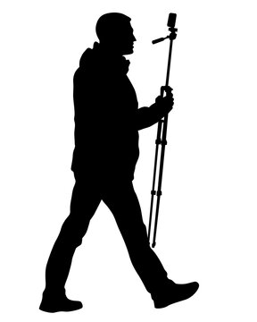 Man with a video camera on a tripod. Isolated silhouette on a white background