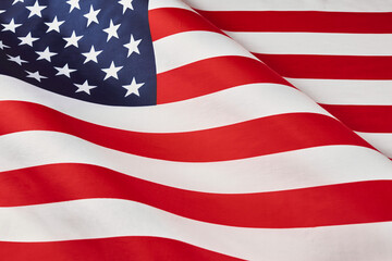 Close up of ruffled American flag. Satin texture curved flag of USA. Memorial Day or 4th of July....