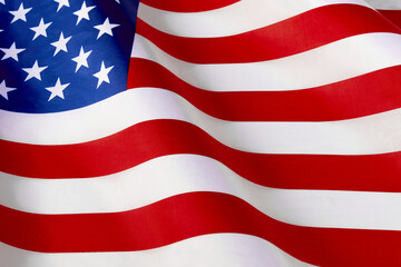 Close up of ruffled American flag. Satin texture curved flag of USA. Memorial Day or 4th of July....